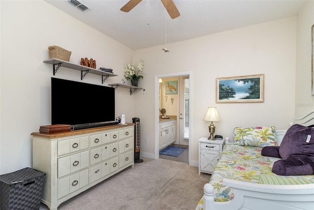 carpeted bedroom featuring ceiling fan and ensuite bathroom