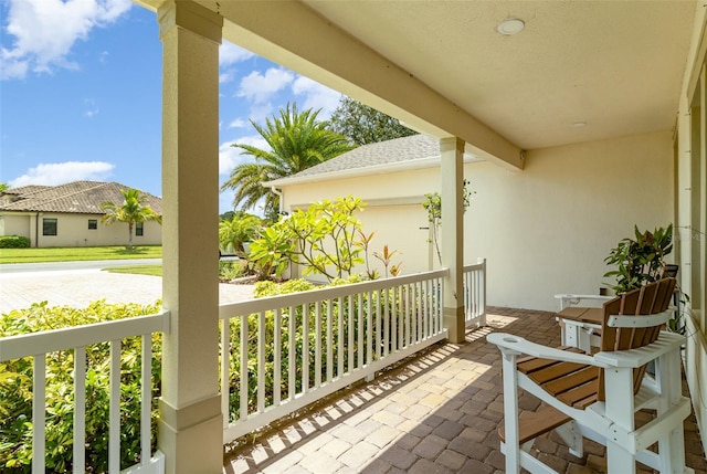 balcony featuring a porch