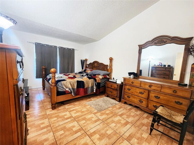 bedroom with light hardwood / wood-style flooring and a textured ceiling