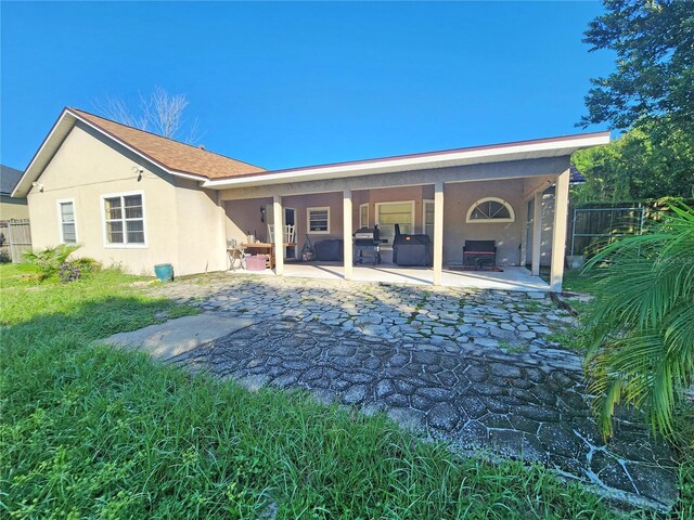 rear view of property with a patio area