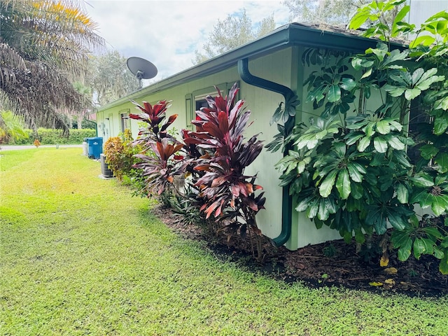 view of property exterior featuring a lawn