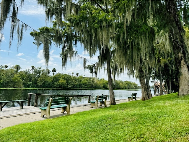 exterior space featuring a yard and a water view