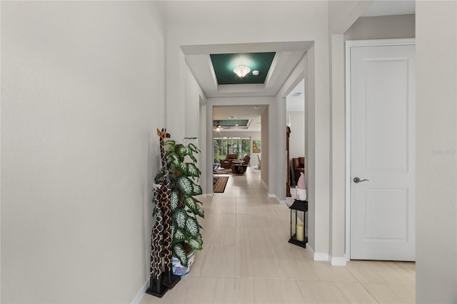 corridor with light tile patterned floors