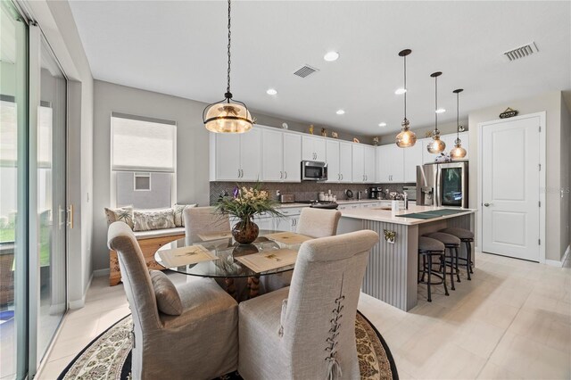 dining area with a wealth of natural light