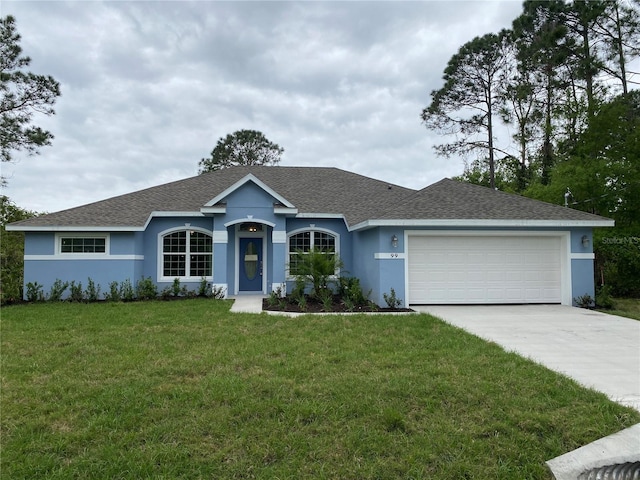 ranch-style house with a garage and a front lawn