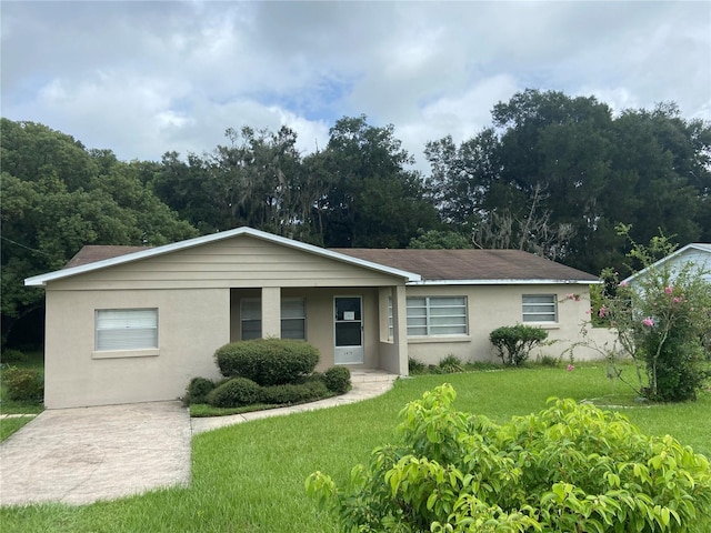 1415 Talton Ave, Deland, FL 32720 - ranch-style home with stucco siding and a front yard