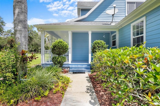 doorway to property featuring covered porch