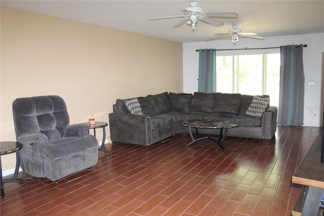 living room with dark hardwood / wood-style floors and ceiling fan