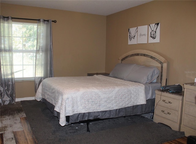 bedroom featuring multiple windows