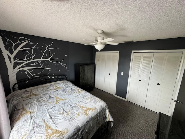 bedroom with a textured ceiling, two closets, ceiling fan, and carpet floors