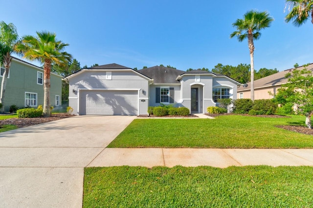 view of front of home with a front yard and a garage