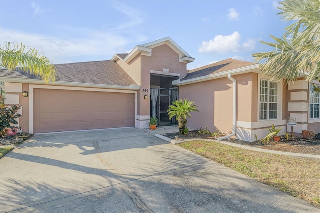 view of front of property with a garage