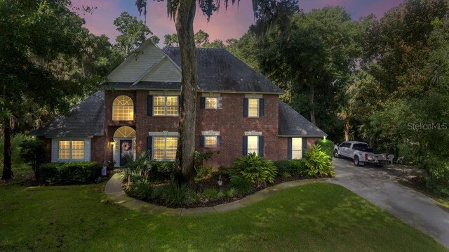 view of front of house with a yard