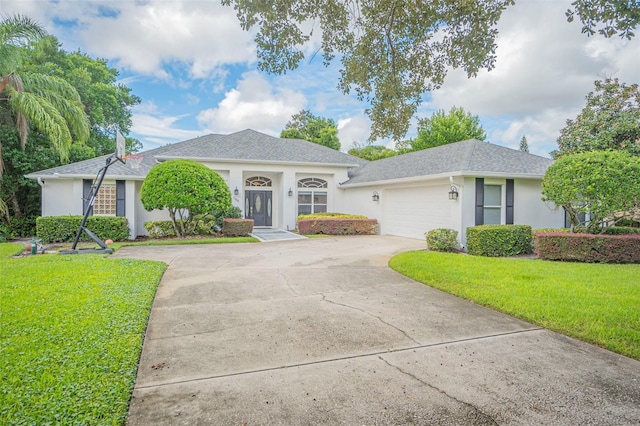 ranch-style home featuring a garage and a front lawn