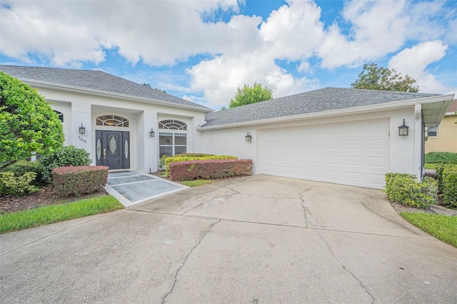 ranch-style home featuring a garage