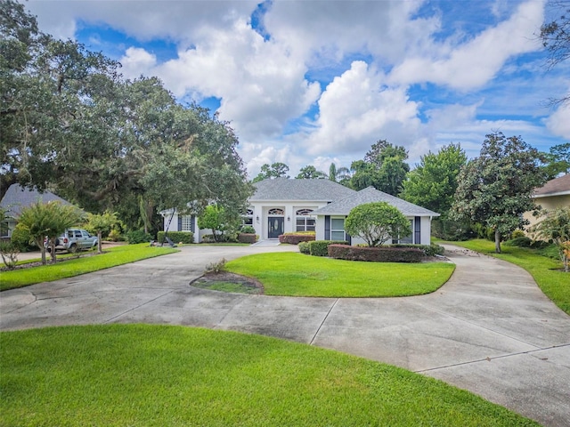 ranch-style home with a front lawn