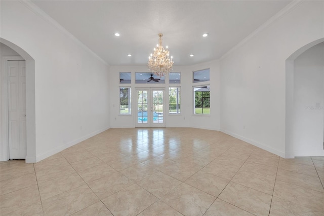 empty room with light tile patterned floors, crown molding, and ceiling fan with notable chandelier