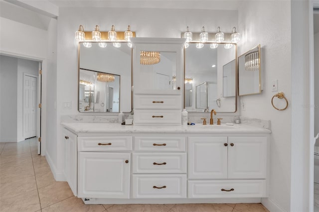 bathroom with vanity and tile patterned flooring