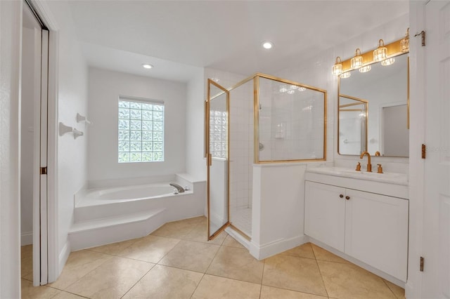 bathroom featuring vanity, independent shower and bath, and tile patterned floors