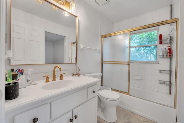 full bathroom with tile patterned floors, toilet, bath / shower combo with glass door, and vanity