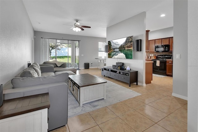 tiled living room featuring ceiling fan