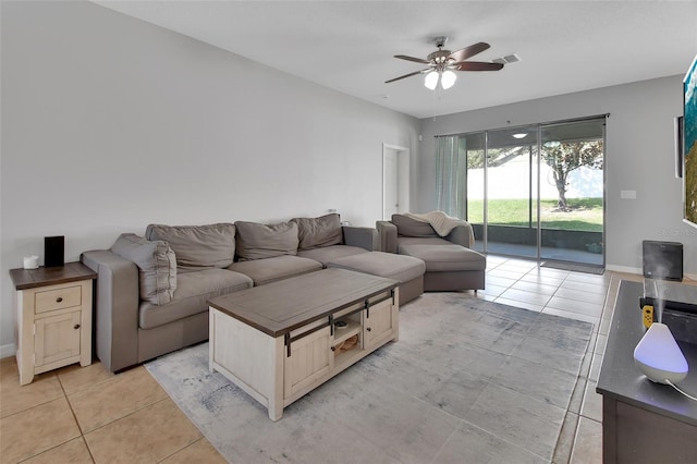 tiled living room featuring ceiling fan