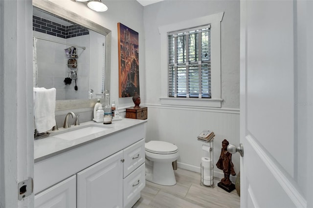 bathroom with vanity, toilet, and a shower with shower curtain