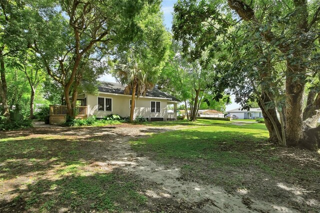 view of yard with a deck