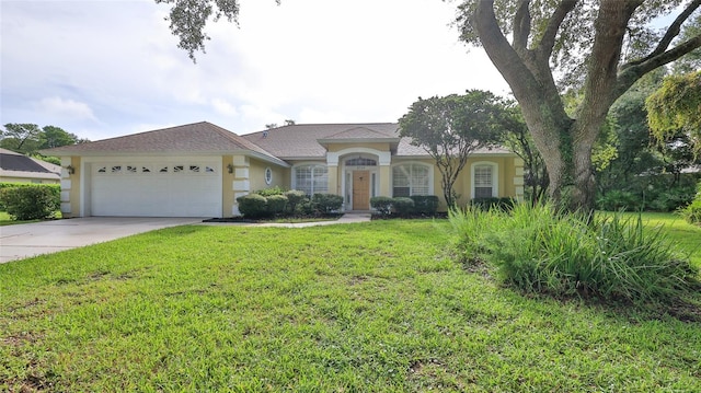 ranch-style house featuring a front yard and a garage