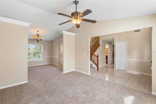 carpeted empty room featuring ceiling fan with notable chandelier, crown molding, a textured ceiling, and vaulted ceiling