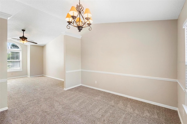 empty room featuring lofted ceiling, ceiling fan with notable chandelier, carpet, and a textured ceiling