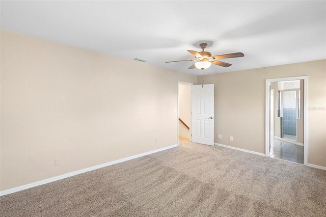 empty room with carpet and ceiling fan