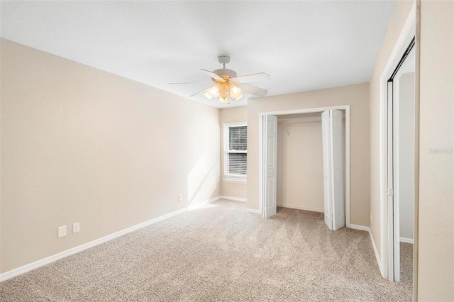 unfurnished bedroom featuring ceiling fan and light carpet