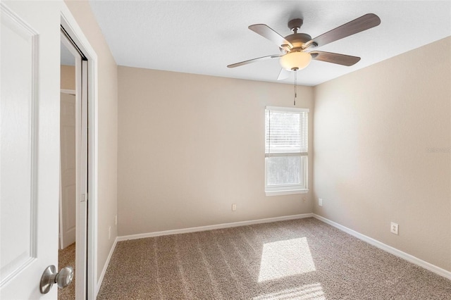 unfurnished bedroom with ceiling fan and carpet