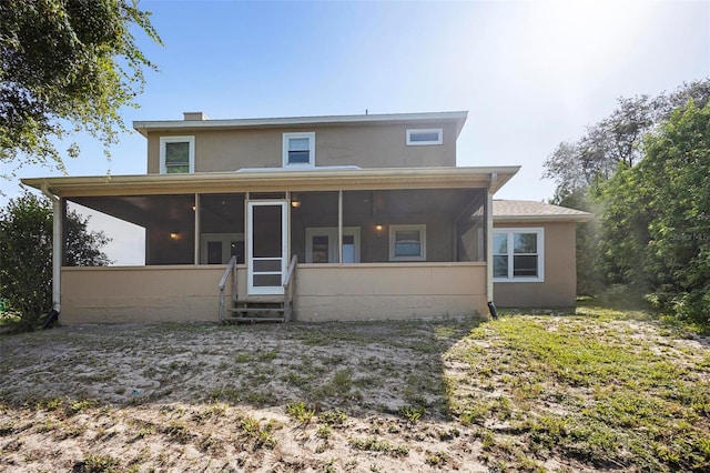 rear view of house with a sunroom