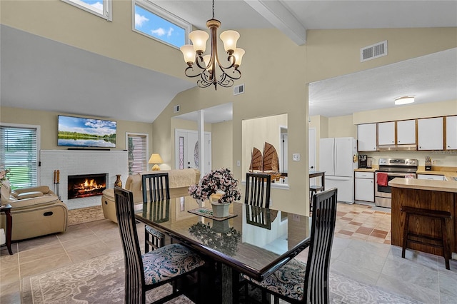 dining space featuring a fireplace, high vaulted ceiling, an inviting chandelier, beam ceiling, and light tile patterned flooring