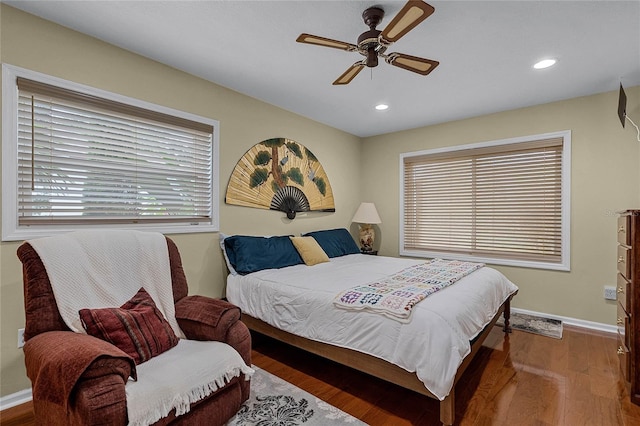 bedroom with hardwood / wood-style flooring and ceiling fan