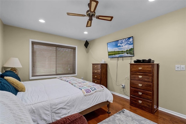 bedroom featuring hardwood / wood-style floors and ceiling fan