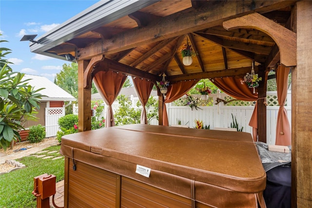 exterior space with a gazebo and a hot tub