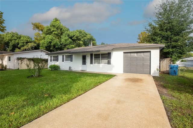 ranch-style home with a garage and a front yard