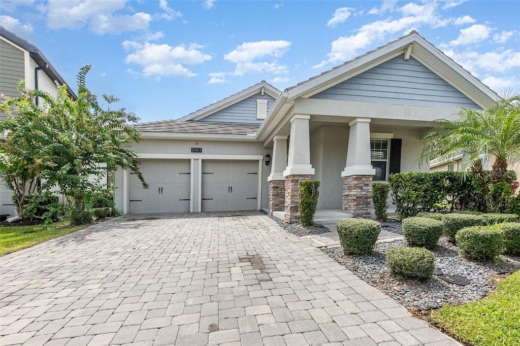 view of front of house with a garage and covered porch