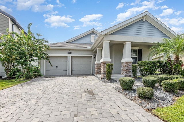 view of front of house with a garage and covered porch