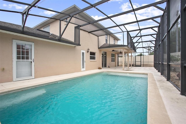 view of swimming pool with a lanai and a patio area