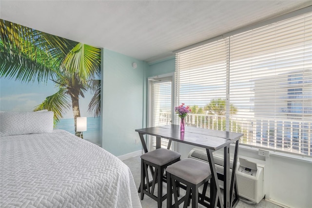 bedroom with multiple windows and light colored carpet