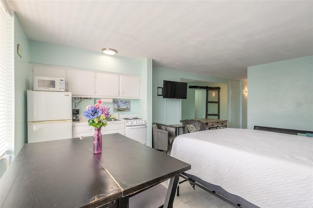 bedroom with white fridge