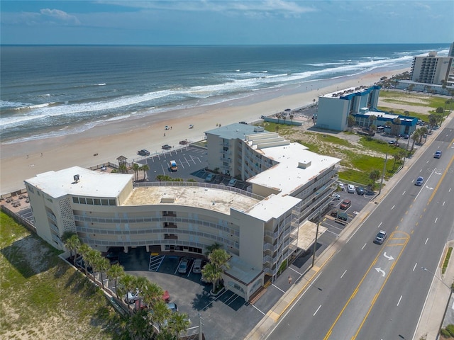 aerial view featuring a view of the beach and a water view