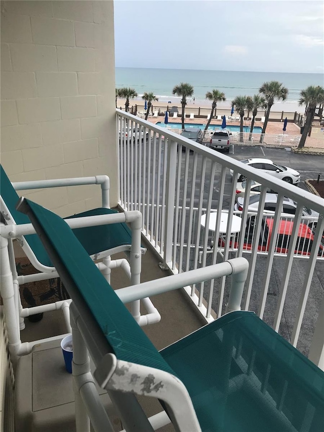 balcony featuring a water view