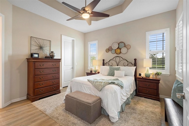 bedroom featuring light wood-type flooring and ceiling fan