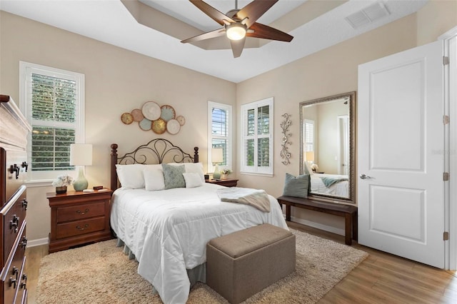 bedroom featuring light hardwood / wood-style floors and ceiling fan