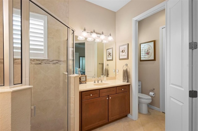 bathroom featuring vanity, tile patterned floors, a shower with shower door, and toilet